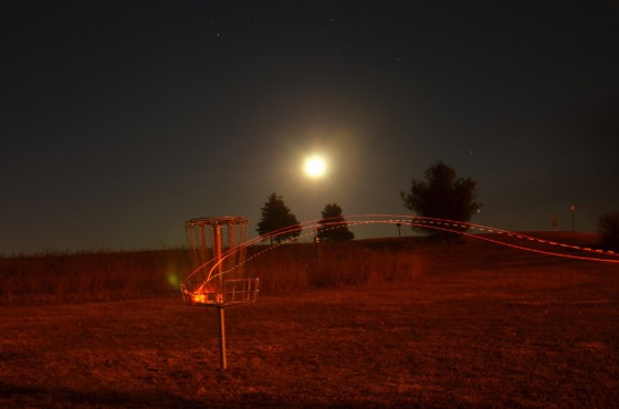Autumn rounds often extend into the night, meaning it's time to tape lights to the discs. (photo courtesy Flying Lea Disc Golf Club)
